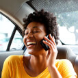 Woman talking on the phone in the back of cab